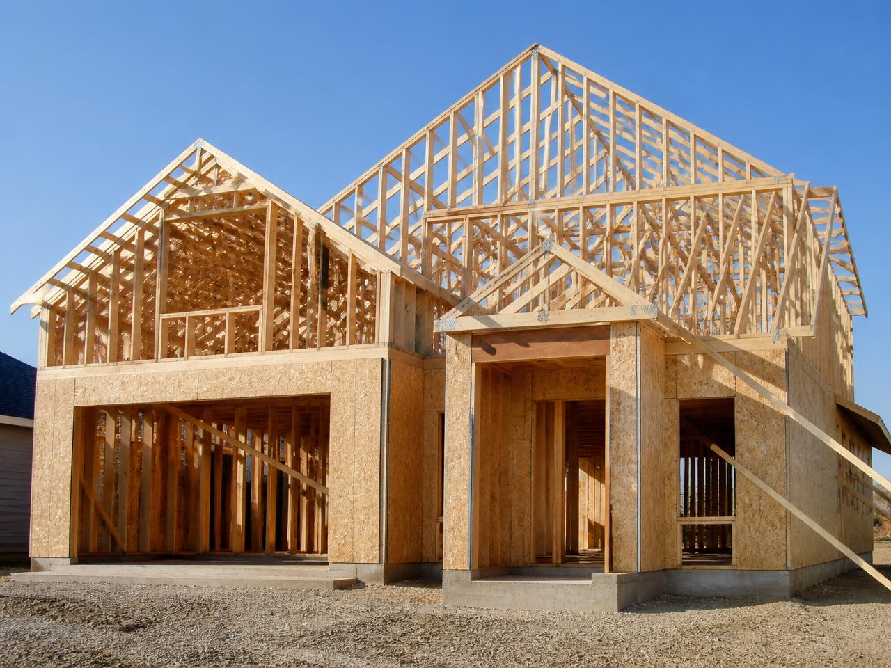 New home under construction with exposed timber framing and trusses